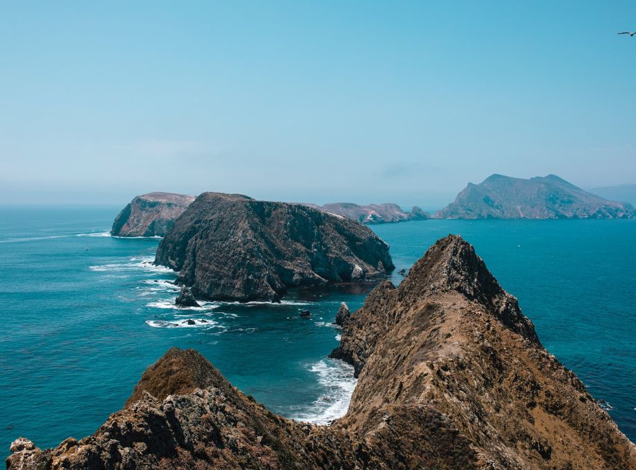 Beautiful View of Small Rocky Mountains surrounded by Sea Water at the Channel Islands National Park, United States