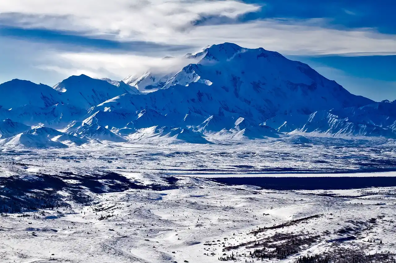Landscape View of Plain Area and Mountains Covered in Ice in Denali National Park, United States