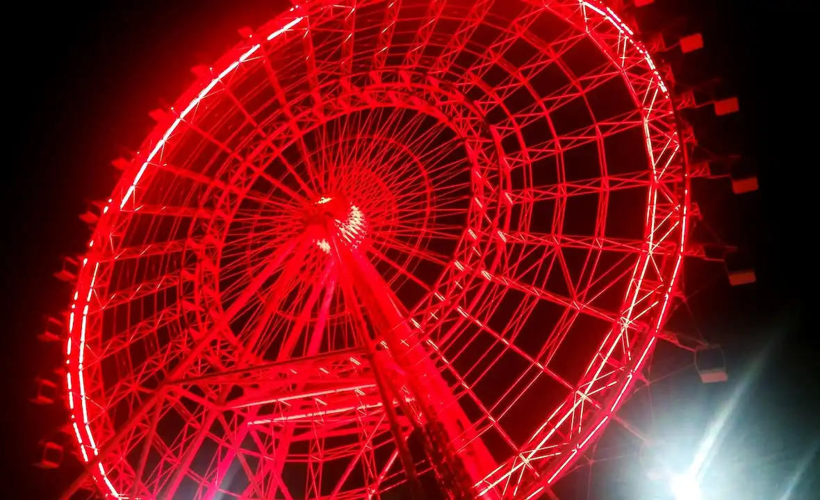 Red Glowing Ferris Wheel at ICON Park, Orlando Florida at night