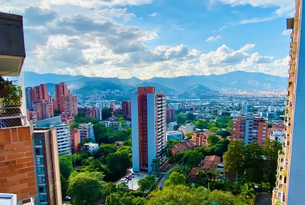 Beautiful Images of High Rise Buildings of Medellín with beautiful blue sky and clouds